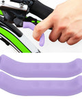 Hand using anti slip silicone brake lever grips set for motorcycle and bike, gel material non slip handle covers, purple color.