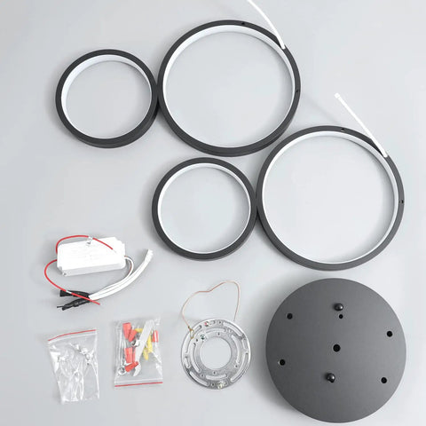 Ultra Sleek Modern LED Flush Mount Ceiling Light With Four Ring Design parts including rings, base, and wiring components