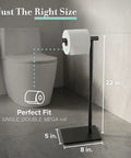 Modern Square Base Toilet Paper Holder Stand In Matte Black No Drill Install Free Weighted And Padded Base For Stable Rust Resistant Metal Bathroom Accessory 22.25 Inch Tall shown beside toilet
