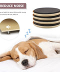 No Sweat Furniture Sliders Four Pack Reusable Floor Glide Pads For Hardwood Surfaces on a bed beside a sleeping dog.