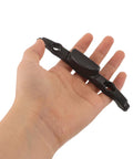 Luggage Repair Button And Replacement Pull Handle Fix Broken Suitcase Grips With Ease Solid Black Plastic held in hand.