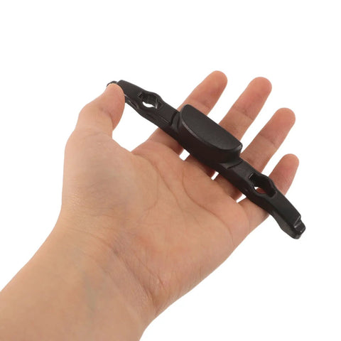 Luggage Repair Button And Replacement Pull Handle Fix Broken Suitcase Grips With Ease Solid Black Plastic held in hand.