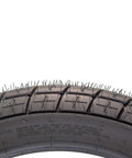 Close-up of 130/80-19 FT30 Dirt Bike Front Tube Type Tire tread pattern for flat track racing, showing sick traction and stable steering.