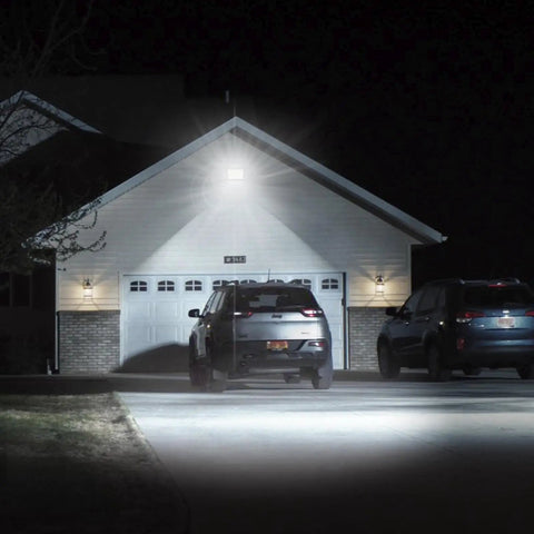 150W Outdoor LED Flood Light With Plug, 18000lm illuminating a driveway at night, showing IP66 waterproof capability