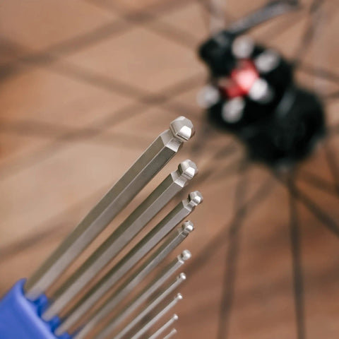 Heavy Duty Hex Allen Wrench Set For Bikes With Long Arm Ball End close-up showing precision tips and bike wheel backdrop