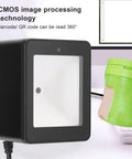 Versatile Desktop Barcode Scanner 9800 with CMOS Imaging on counter, showing 360 degree orientation, black sleek design.