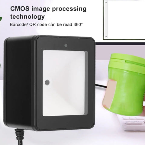 Versatile Desktop Barcode Scanner 9800 with CMOS Imaging on counter, showing 360 degree orientation, black sleek design.