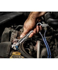 A hand using a deep socket wrench from the Kickass 191 Piece Mechanics Tool Set With Deep Socket Wrenches Ratchets Hardened Chrome Steel For Underhood Auto Repair And Garage Builds Beast Mode Workhorse on an engine.