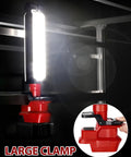 Milwaukee 18V Compatible LED Work Light 30W 2400LM with large clamp mounted on metal frame, showing detail of clamp mechanism