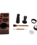 Real Deal 58mm Espresso Tamper Set With Solid Wood Station, black tamper and cleaning brush shown on wood base.