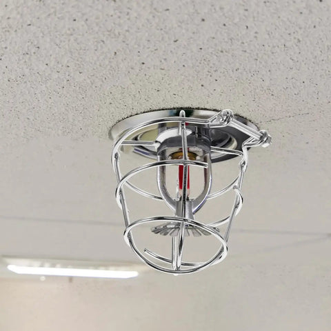 Heavy Duty Tough As Nails Fire Sprinkler Head Covers Screw Type Protector Cage 2 Pack mounted on ceiling with chrome finish.