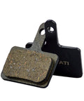 Two resin brake pads for bikes, universal fit for TRP Tektro Shimano, showcasing grippy texture and durable design.