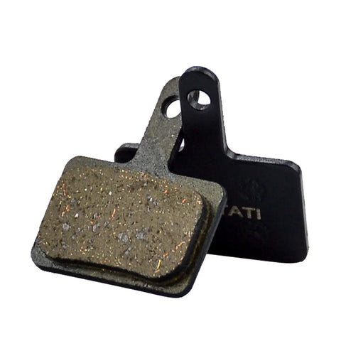 Two resin brake pads for bikes, universal fit for TRP Tektro Shimano, showcasing grippy texture and durable design.