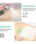 xTool Black Laser Marking Spray bottle, 8.5 oz, being sprayed onto metal with even coating and fast-drying graphic