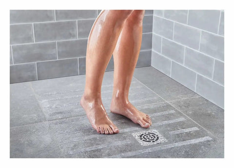 Person standing on Slip Resistant Safety Walk Medium Duty Grippy Tread Gray Self Adhesive Backing For Wet Indoors Outdoors 4x6ft