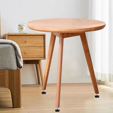 Table showcasing 4 Pack Adjustable Rubber Feet for Furniture With Screw In Design for non-slip stability on wooden floor.