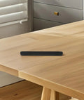 12 Piece Black Plastic Drawer Glides Set for Cabinets and Dressers Easy DIY Friendly Bottom Mount Sliders on wood surface