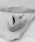 Two Piece Car Sun Visor Clip Hook Bracket Replacement 74348 06030 for Toyota Camry and Corolla on stone surface