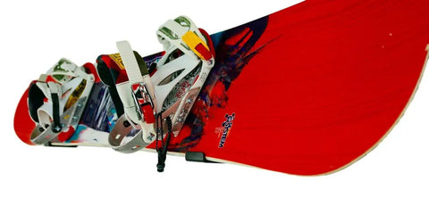 Red snowboard mounted on Heavy Duty Snowboard Wall Mount Rack For Garage Organization And Wall Storage with bindings