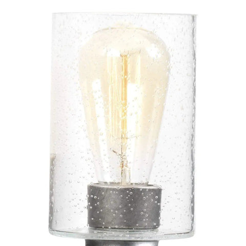 Close-up of Coastal Bath Vanity Light Two Light Fixture With Clear Seeded Glass And Galvanized Metal Finish Perfect For Seaside Vibe Bathrooms Damp Rated And Durable For Everyday Use, showing bulb detail in clear seeded glass.