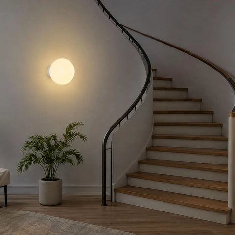 Minimalist Globe Wall Sconce, 1-Light White E27 Round Wall Light Fixture illuminating a staircase with a smooth finish.