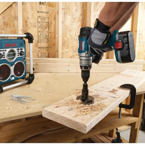 Person using Self-Feed Drill Bit With 7 Sixteenths Hex Shank For Minimal Slippage Deep Cutter Gullets For Smooth Drilling