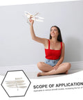 Smiling woman holding model plane with 5 Piece RC Airplane Propeller Blades Rad High Performance Rubber Band Powered Gear displayed