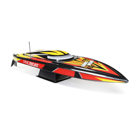 Sonicwake V2 36 Inch Self Righting Brushless RC Boat with colorful design on stand, side view