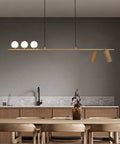 Top Shelf Real Walnut Ceiling Pendant Light, Sleek Chinese Modern Dining Room Chandelier, Heavy Duty Restaurant Hanging Lamp Fixture For Kitchens Bars And Tea Houses in a contemporary kitchen setting.