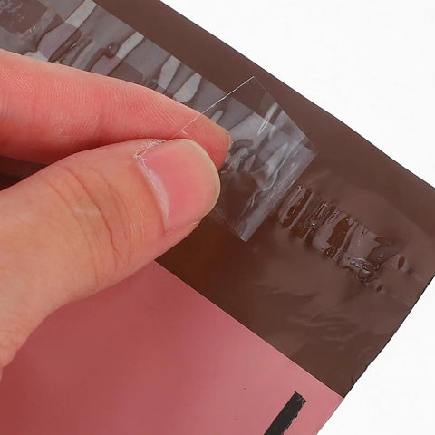 Close-up of adhesive seal on Pink 15x27cm Self Sealing Poly Mailer Bags Pack Of 100 Tear-Resistant Shipping Mailers For Small Business