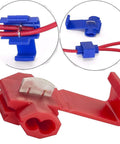 Solderless quick-splice wire tap connectors, blue insulated, installed on red wire for 22-10 AWG electrical wiring.