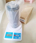 Hydraulic Auxiliary Filter Replacement 6900 0056 for JS130 JS160 JS180 on scale with packaging box
