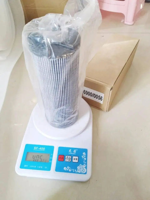 Hydraulic Auxiliary Filter Replacement 6900 0056 for JS130 JS160 JS180 on scale with packaging box