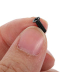 Close-up of a single screw from 500 Piece Laptop Screw Kit With M2 M2.5 M3 Countersunk SelfTapping Flat Head Screws, Carbon Steel in hand