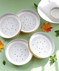 Ten Pack Metal Bee Entrance Feeders 2.87 Inch For Beehives shown on green background with fall leaves, top view
