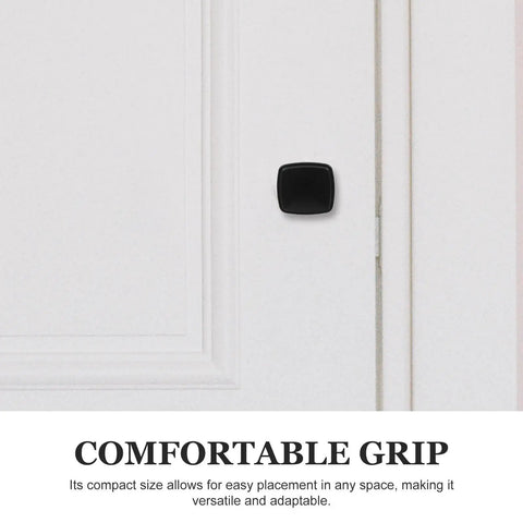 Sleek Black Aluminum Cabinet Knobs Featuring Smooth Texture No Sweat Installation For Kitchen Bedroom Drawer Pulls Modern Cupboard Handles Six Piece Home Refresh Kit mounted on a white door.