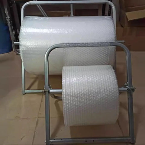 Heavy Duty Bubble Wrap Roll Dispenser Tabletop Packing Station Manual Foam Cushion Holder For Shipping And Moving Supplies Galvanized Steel Stand with two rolls of bubble wrap.