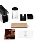 Pixie EN127S One Button Capsule Espresso Machine with accessories and manuals displayed on a white surface