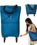 Collapsible Shopping Cart With 360 Degree Swivel Wheels in lake blue shown folded and carried by a woman
