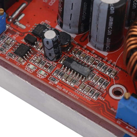 Close-up of a circuit board section of Beefy 1200W 20A DC-DC Boost Converter for cars, showing components and connections.