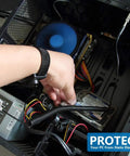 Hand wearing Anti Static ESD Adjustable Metal Wrist Strap With 8 Foot Coiled Cord inside computer case to prevent static damage.