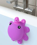 Hot Pink Silicone Bathtub Overflow Drain Cover For A Deeper Soak attached to a tub, octopus design, fitted over overflow drain