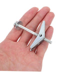 Hand holding Petal Expansion Screws Set M5x60mm For Hollow Walls Drywall Gypsum Board Round Head Toggle Bolts Kit