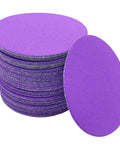Get Ready For Some Serious Sanding With These 100 Piece 5 Inch Grit 80 To 600 Wet Dry Sanding Discs showing purple discs in a stack.