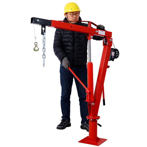 Bedside Warrior 2000 Lb Hydraulic Truck Crane With Manual Hand Winch, red steel frame with hoist, operated by a man wearing safety gear.