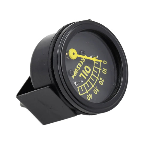 Front-angled view of black oil pressure gauge with yellow needle and mounting bracket