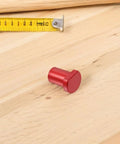 Red piece from Six Piece Aluminum Bench Dogs And Table Clamp Set With Low Profile Stops For Woodworking Tenon Design Quick Tightening