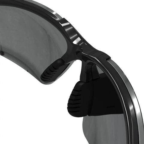 Close-up of black frame impact resistant safety eyewear with mirror lenses for work, ANSI Z87+ rated, polycarbonate eye protection.