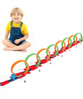 Child playing with Crazy Fun 360 Degree Loop Track with eight loops and five 1:64 scale toy cars, perfect gift for ages 3 to 7.