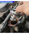 Built Tough Car Engine Coolant Thermostat With Gasket Offers Rock Solid Performance being installed in a truck engine.